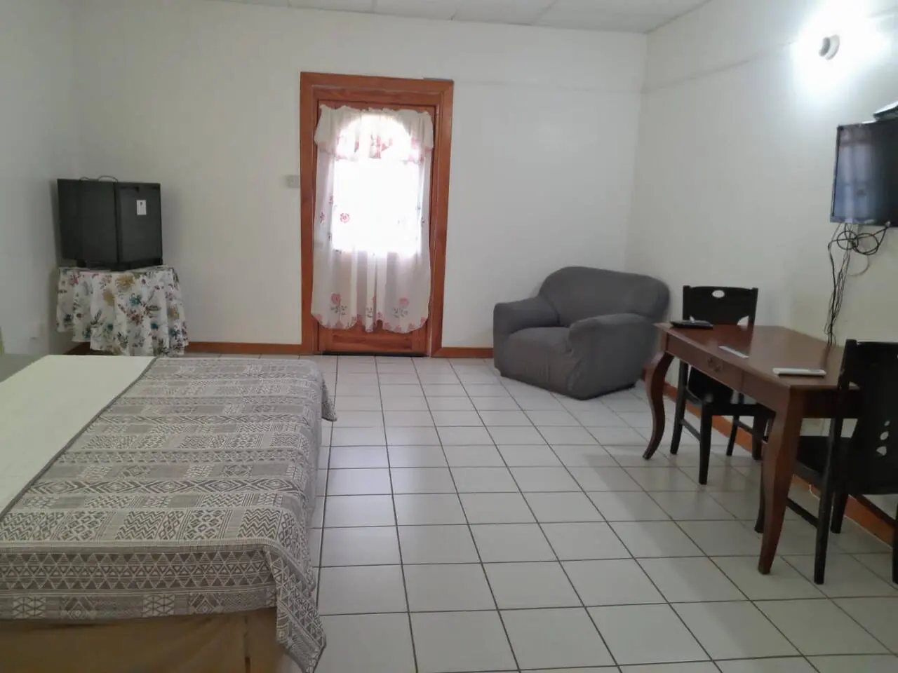 Room with TV and desk