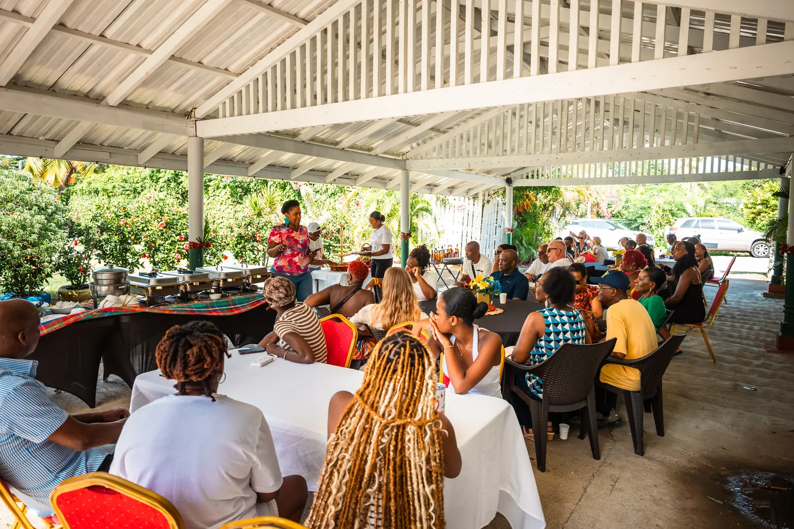 Guests seated for lunch under the pavilion