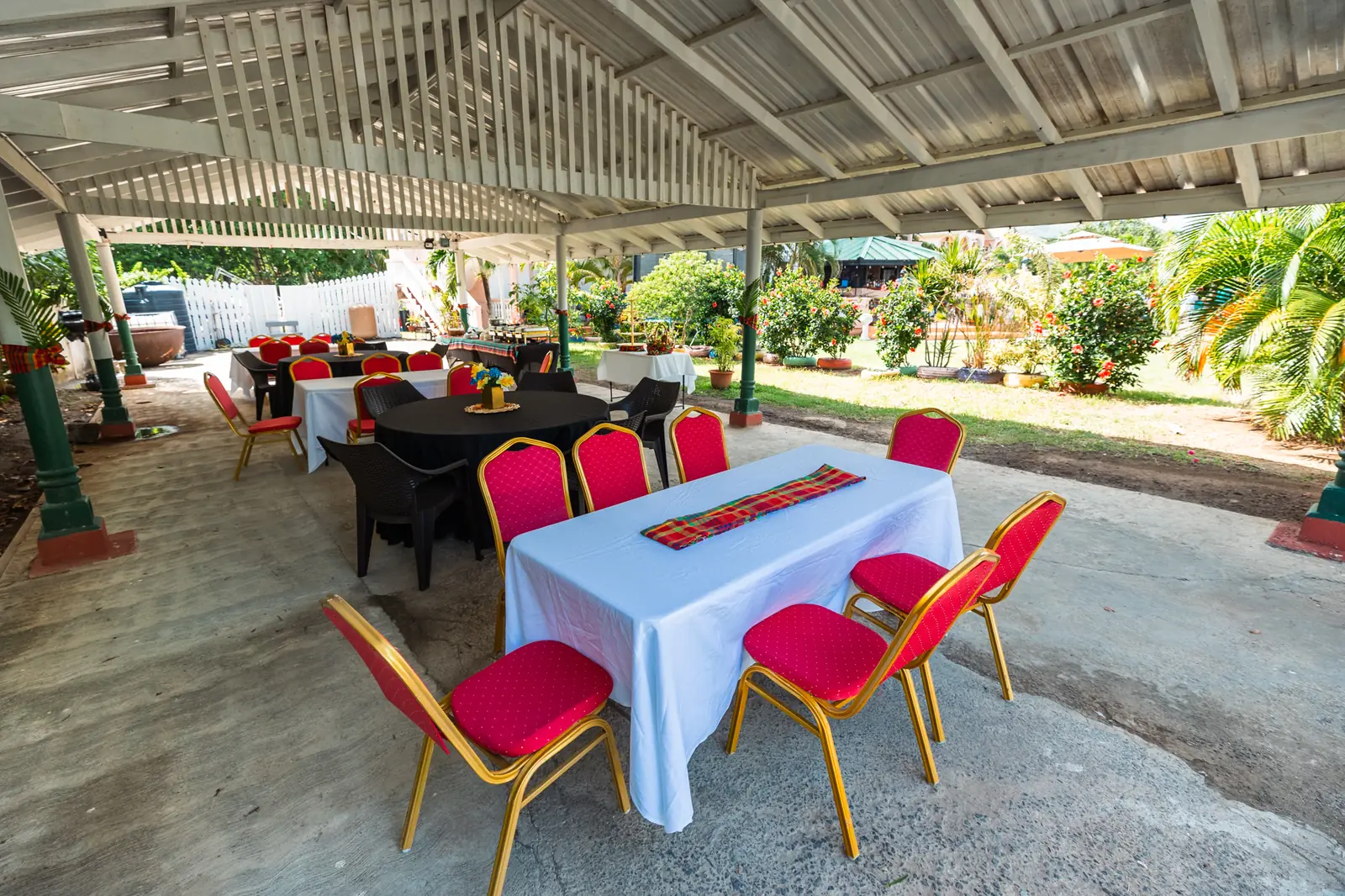 Covered pavilion with tables set for guests