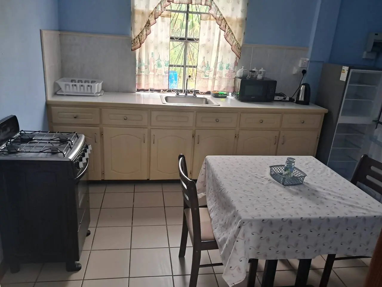 Kitchenette with stove and dining table