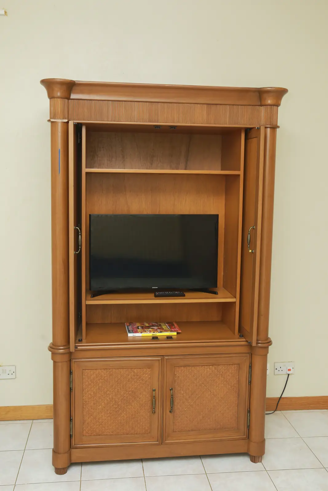 Wooden armoire with TV