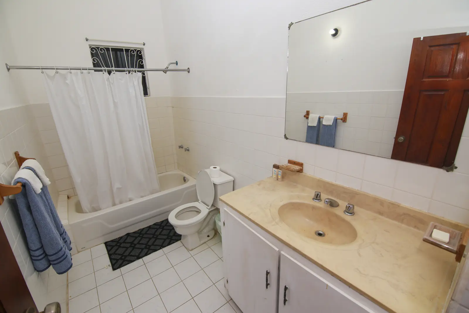Bathroom with tub and vanity