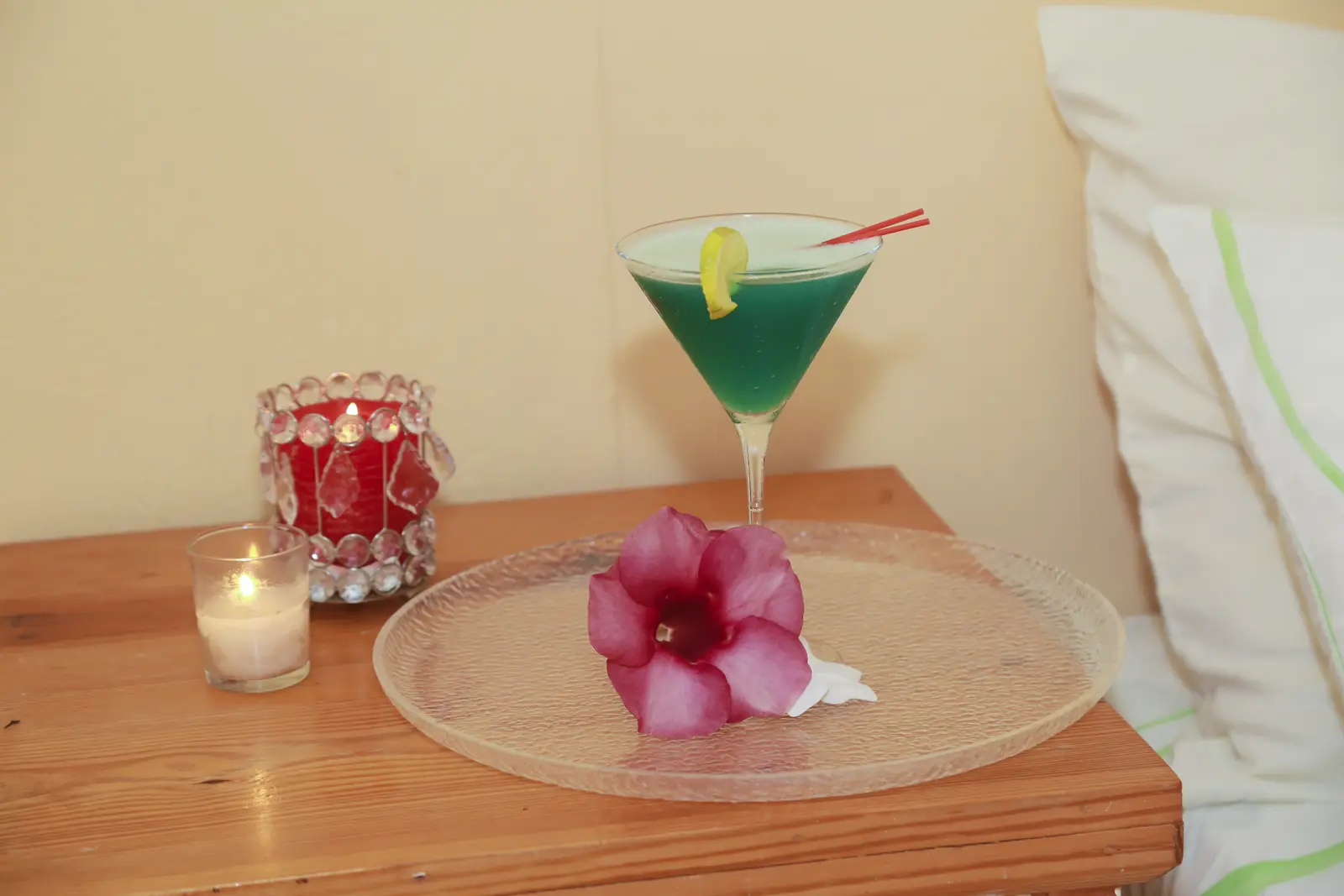 Cocktail garnished with a hibiscus flower