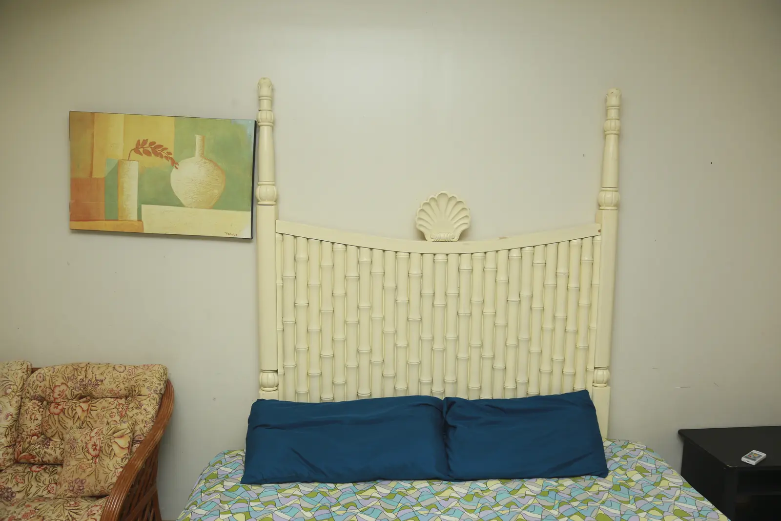 Bed with rattan headboard