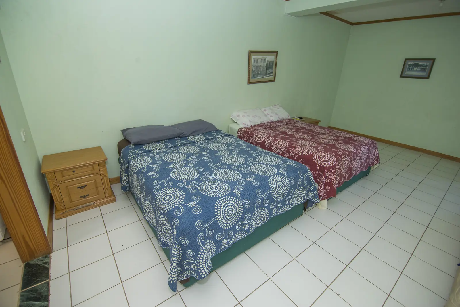 Air-conditioned guest room with two beds at Hewanorra Gardens