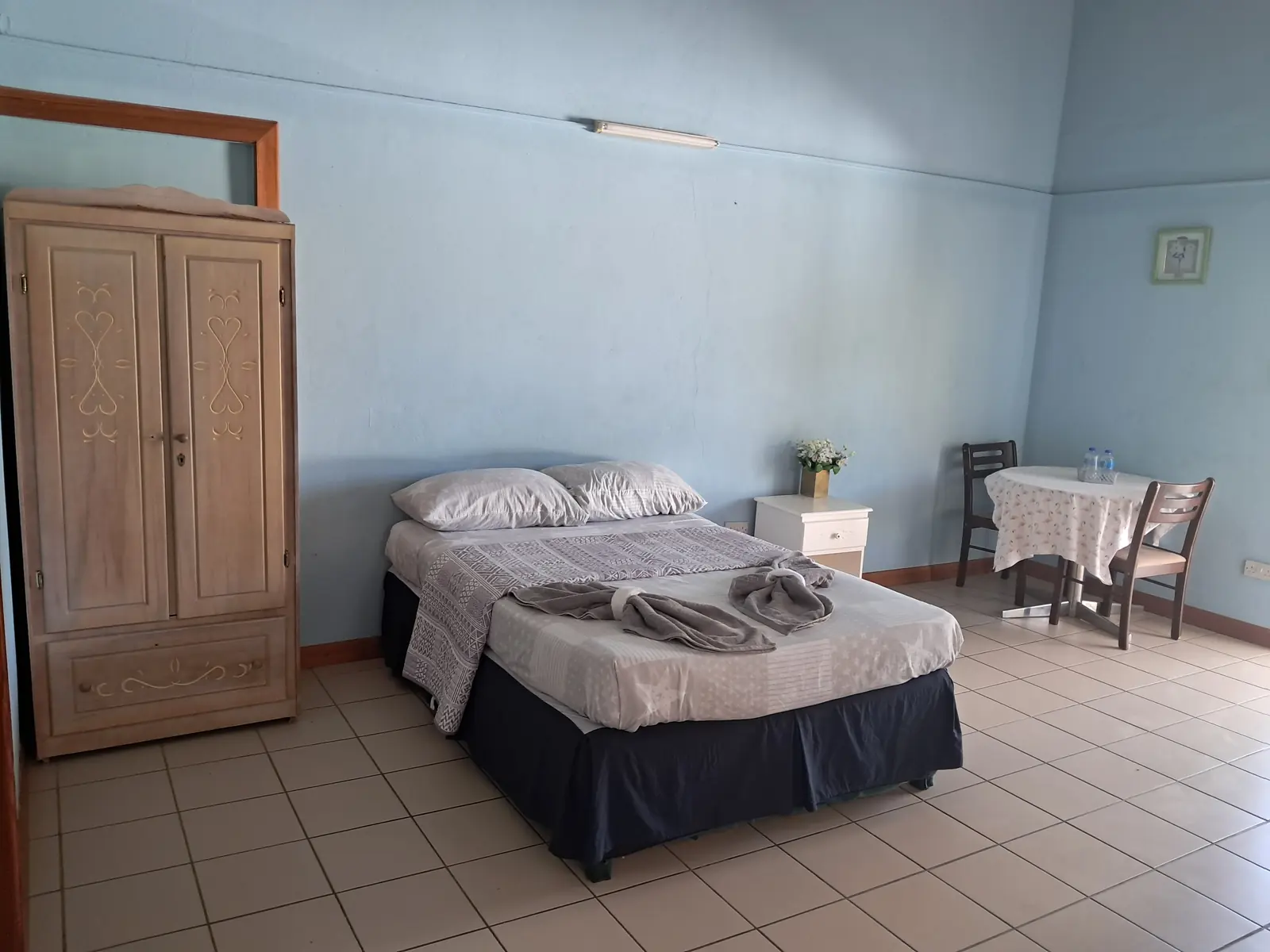 Bright room with wardrobe and bed