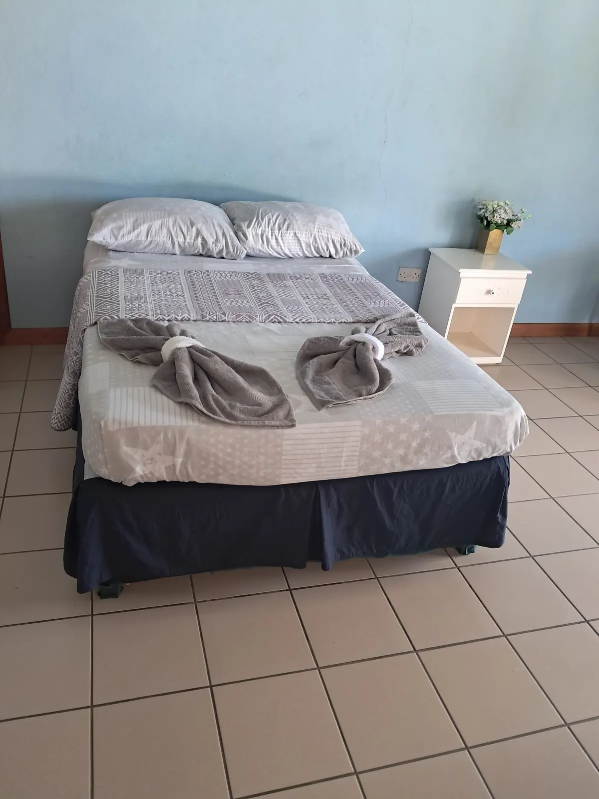 Bed with folded towels