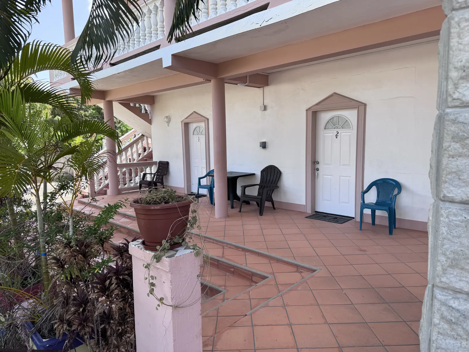 Covered veranda with tropical plants at Hewanorra Gardens